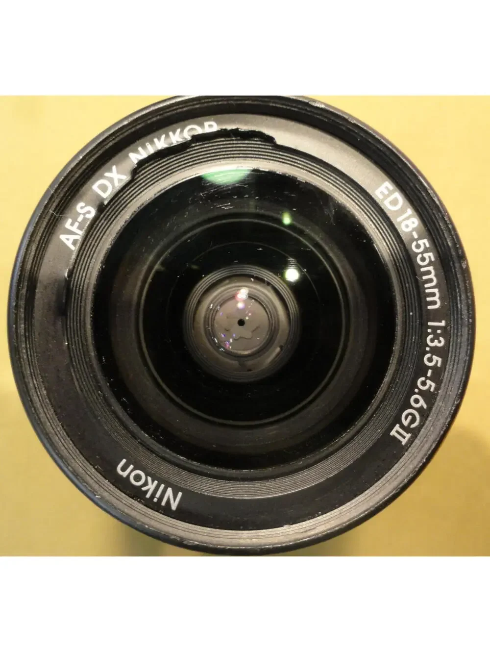 NIKON DX SWM ED ASPHERICAL 0.28M/0.92FT 52 US 6766543 18-55 MM 1:3.5-5.6 G II